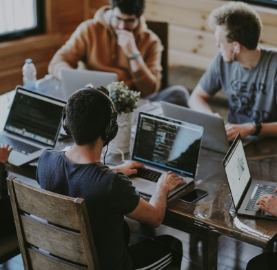 group of people using laptop computer